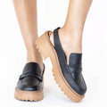 Elodie platform mules in black embossed leather